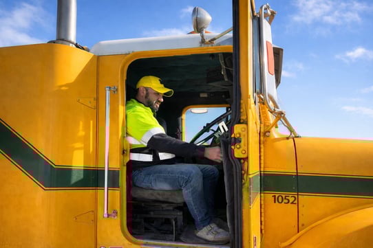 Focused Driver In Yellow Freightliner Cabin